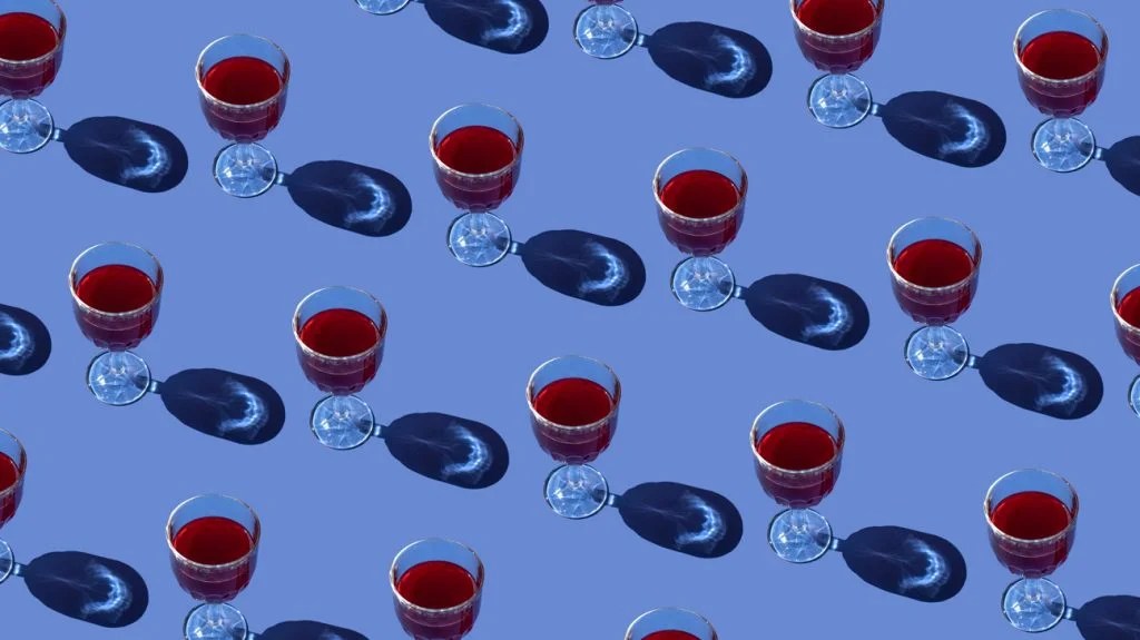 An image of many glasses of wine. A person may consume this amount if they were binge drinking.
